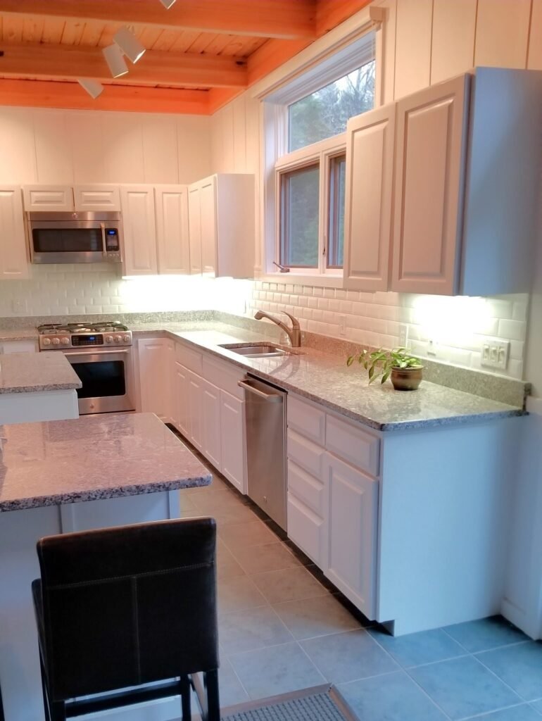 After shot of kitchen with white cabinets restored