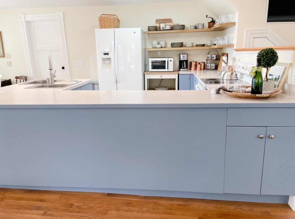 A front view of the cornerstone blue and white kitchen