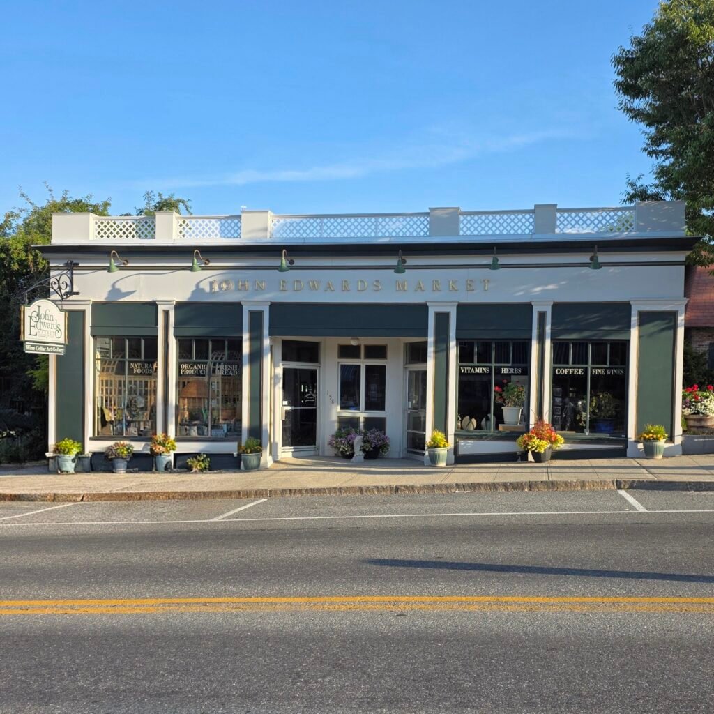 Street view on a sunny day of Ellsworth staple store John Edwards