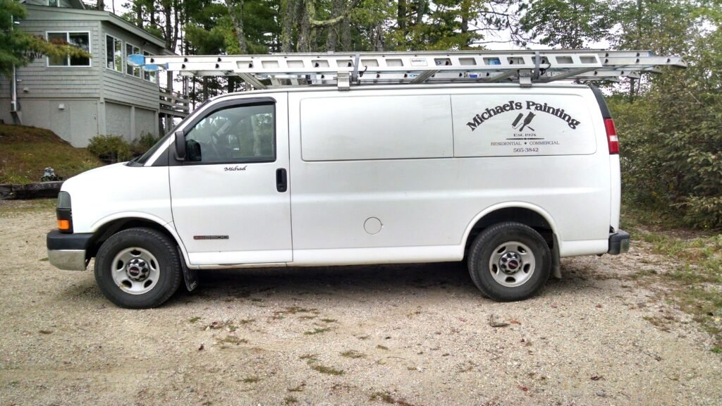 White work van with Michael's Painting logo on it