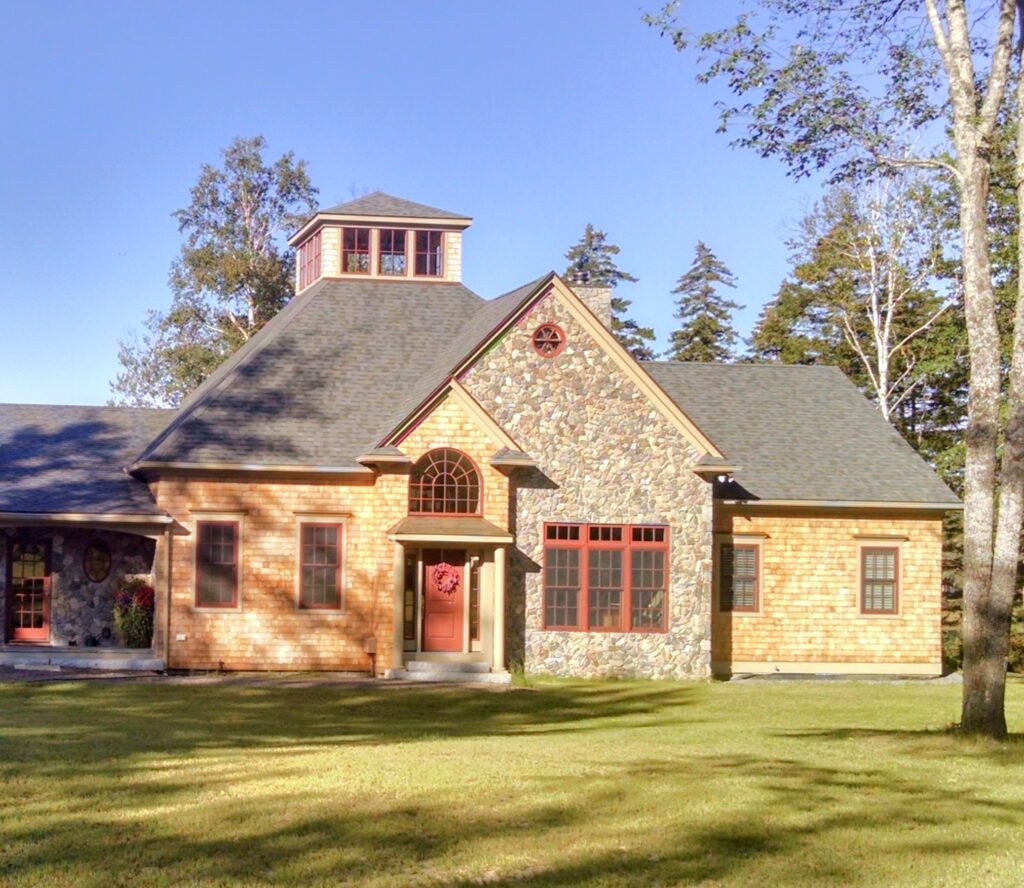 Custom made home that required cutting in on the windows and doors, as well as staining the wood shingles.