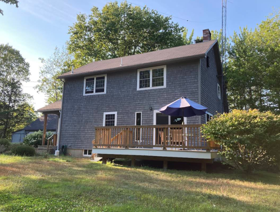 BLue gray multi story house with white trim